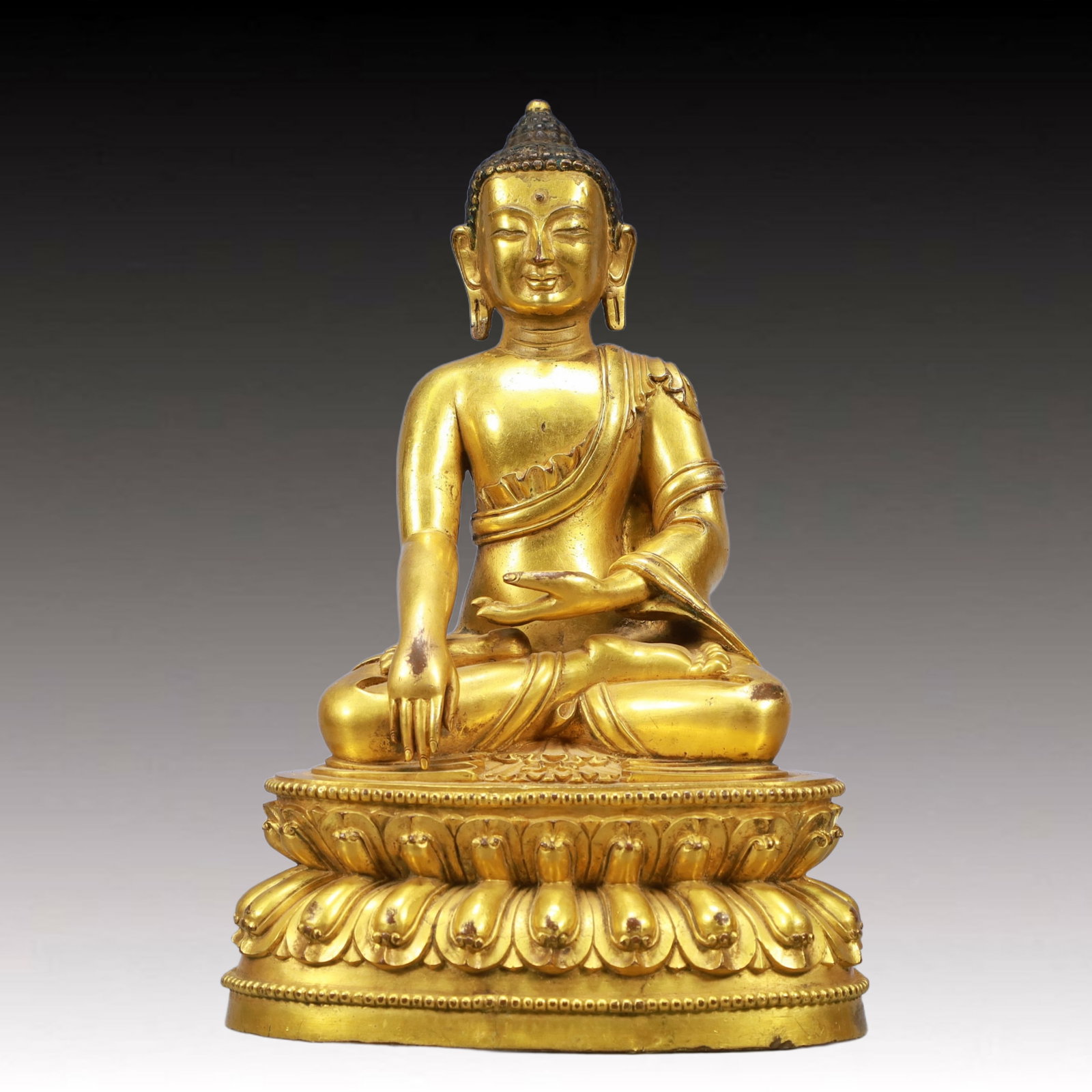 A Solemn Gilt Bronze Statue of Sakyamuni: A Solemn Gilt Bronze Statue of Sakyamuni ,Ming Dynasty, China,Size:7.3inx6.1inx11in Weight:4050g 铜鎏金释迦牟尼像,中国明代