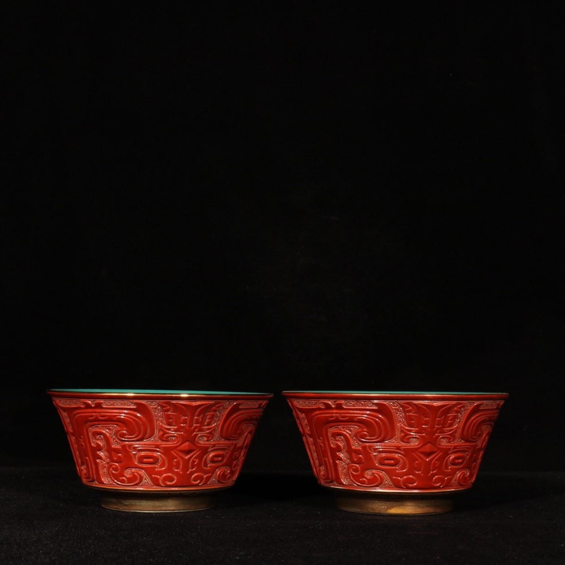 A Pair of Exquisite Coral Red Glazed Painted Gold Beast-Face Pattern Cups: A Pair of Exquisite Coral Red Glazed Painted Gold Beast-Face Pattern Cups,Qing Dynasty,China,Yongzheng Four-character Mark,Size:1.9inx3.5in 一对珊瑚红描金