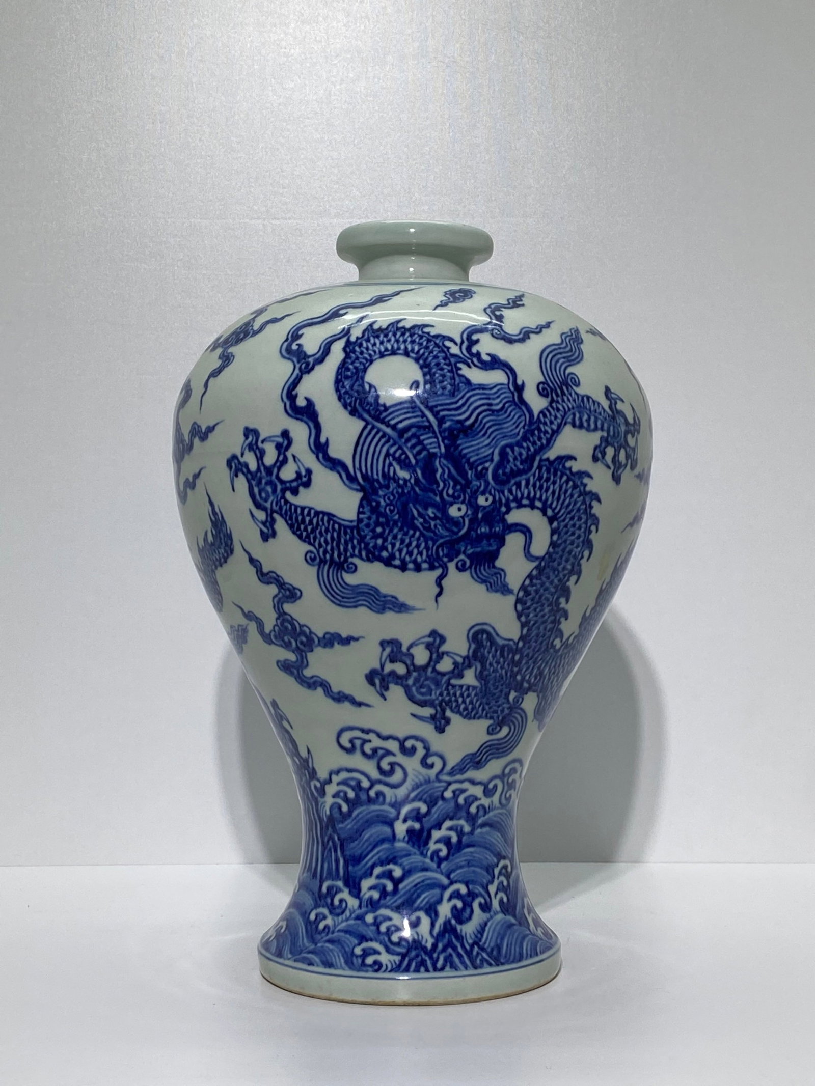 A Rare Blue and White Seawater and Dragon Pattern Vase: A Rare Blue and White Seawater and Dragon Pattern Vase,Qing Dynasty,China,Qianlong Six-character Mark,Size:15.6inx10.2in 青花海水龙纹瓶,中国଀