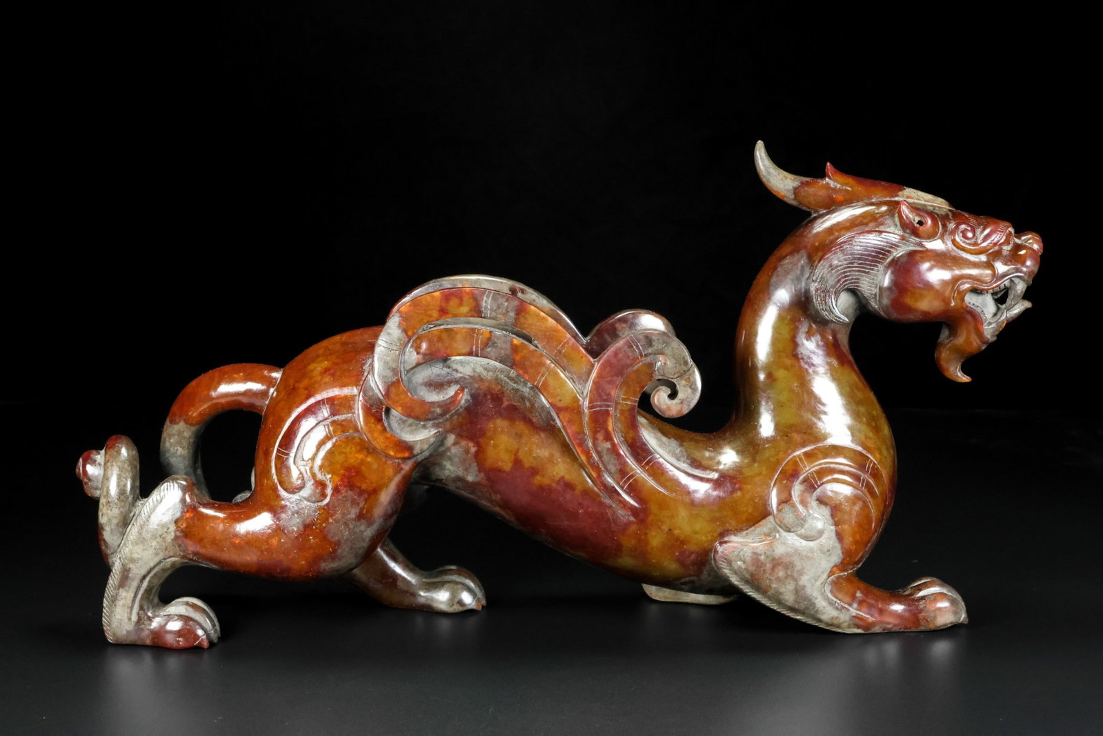 An Exquisite Archaic Jade Auspicious Beast Ornament: An Exquisite Archaic Jade Auspicious Beast Ornament,Ancient Time,China,Size:7.5inx3.1inx14.6in,Weight:3368g 高古玉瑞兽摆件,中国远古