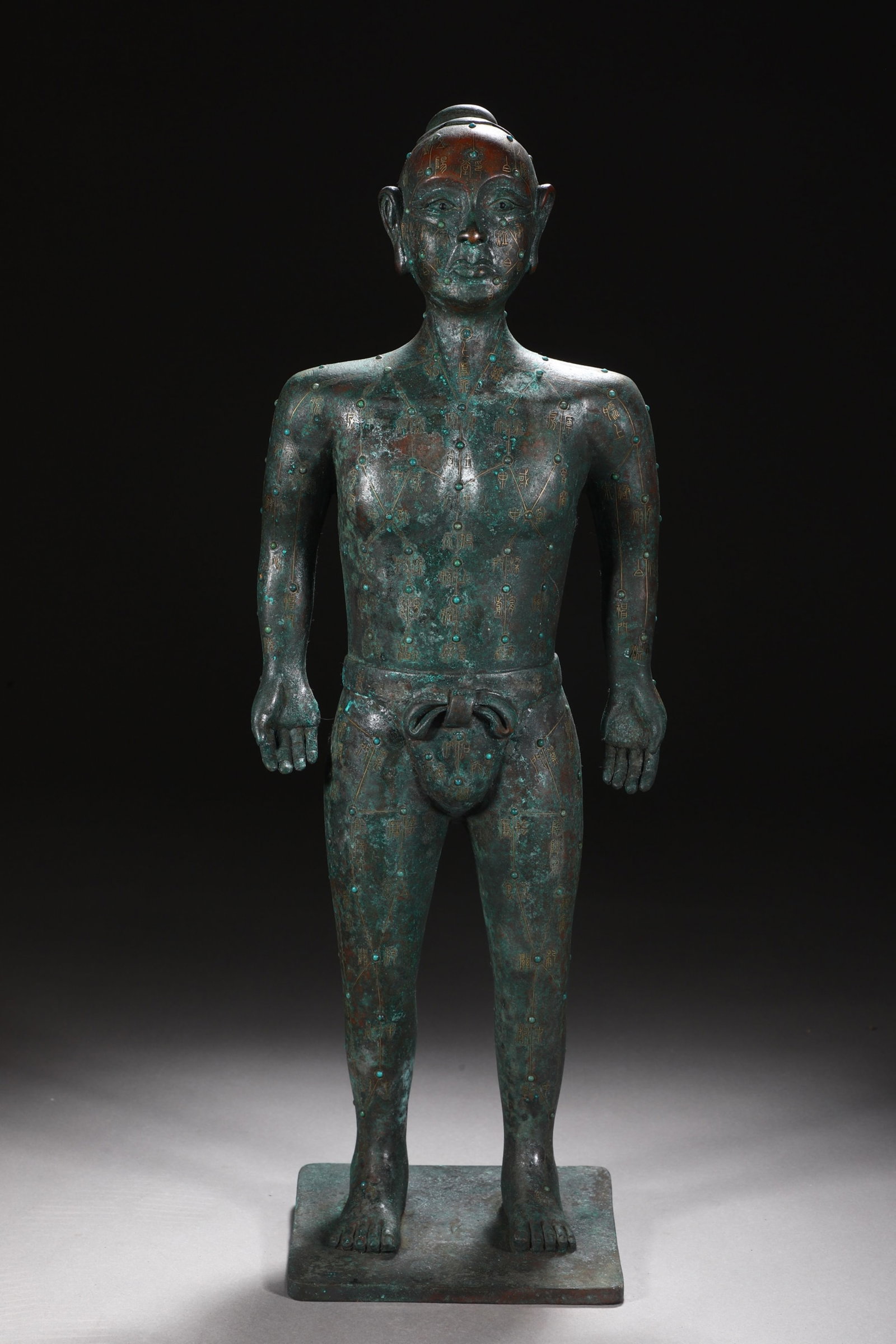 An Exquisite Bronze Inlaid Gold and Silver Figure Ornament: An Exquisite Bronze Inlaid Gold and Silver Figure Ornament,the Warring States period in China,Size:20.3inx7.3in,Weight:6150g 铜错金银人物摆件,中&#