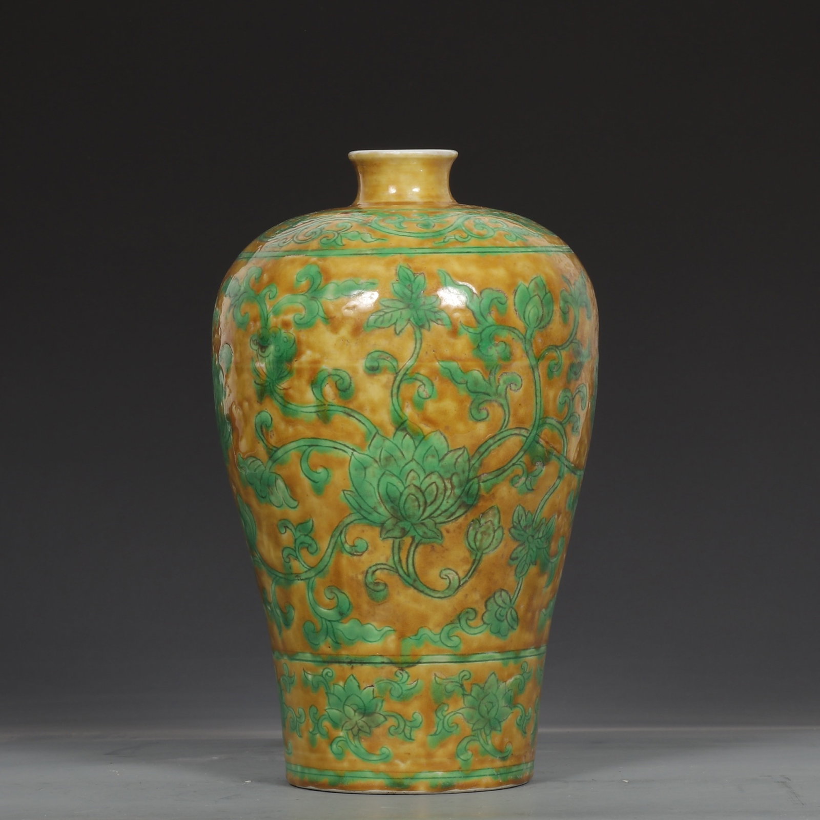 An Exquisite Yellow Ground Green Glazed Lotus Pattern Vase: An Exquisite Yellow Ground Green Glazed Lotus Pattern Vase,Ming Dynasty,China,Size:9.8inx6.1in 黄地绿釉缠枝莲纹瓶,中国明代