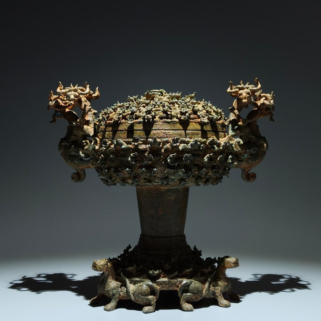 An Archaic Bronze Chi-Dragon Pattern Dragon-Ears Censer,With Inscription: An Archaic Bronze Chi-Dragon Pattern Dragon-Ears Censer,With Inscription,the Warring States period in China,Size:12.2inx13inx7.9in 青铜螭龙纹龙耳香Ġ
