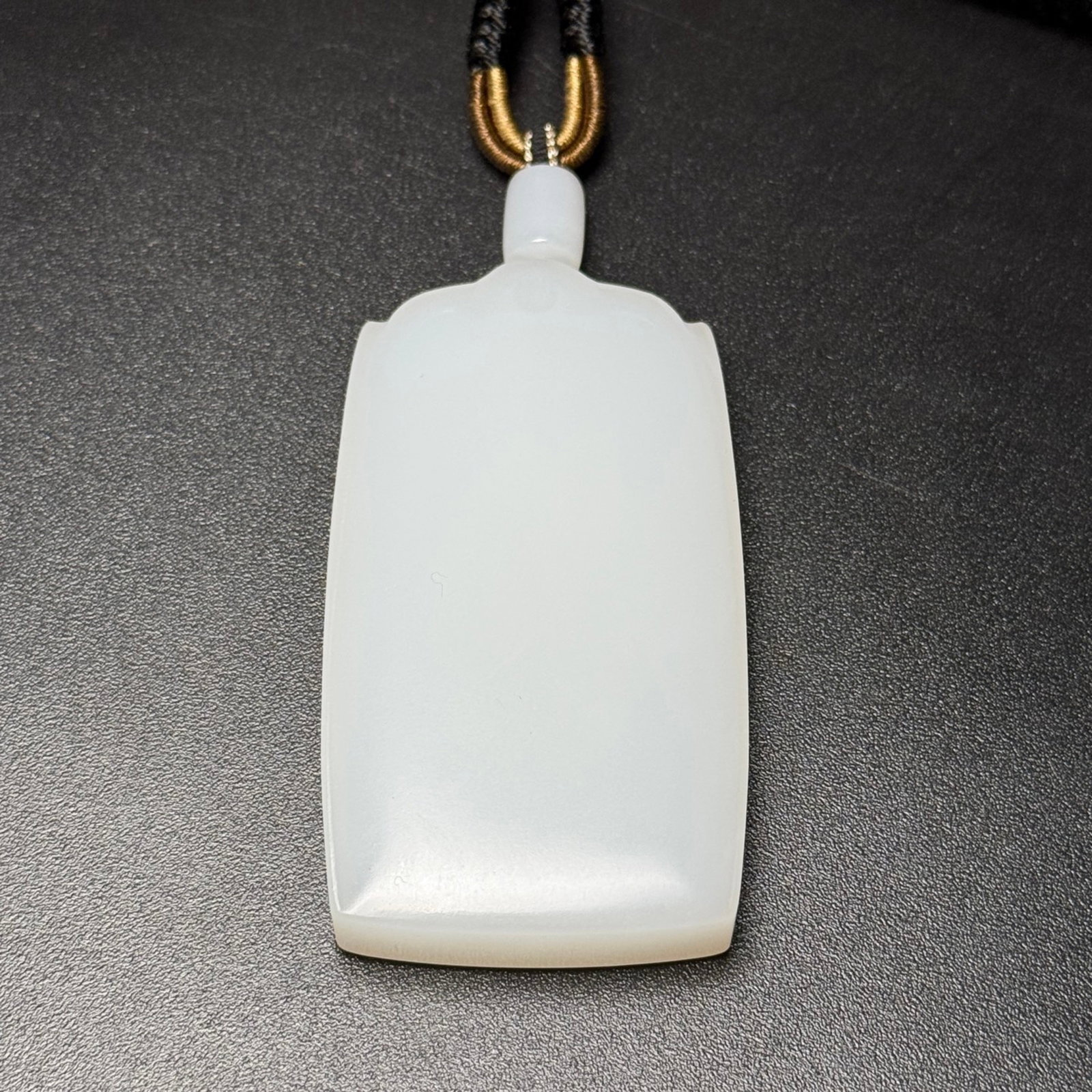 An Exquisite White Jade Pendant: An Exquisite White Jade Pendant,Qing Dynasty,China,Size:2.8inx1.6inx0.5in,Weight:92g 白玉牌,中国清代