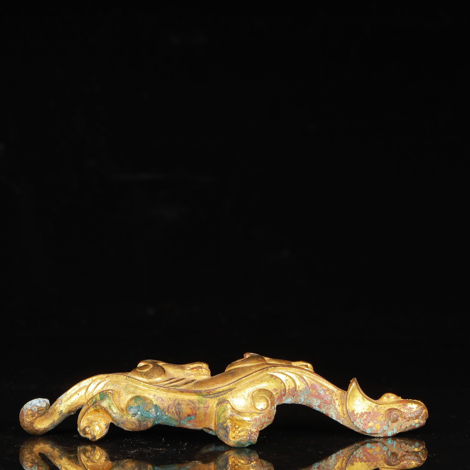 An Exquisite Gilt Bronze Dragon Ornament: An Exquisite Gilt Bronze Dragon Ornament,Qing Dynasty,China,Size:6.3inx2inx1.6in,Weight:209g 铜鎏金龙摆件,中国清代