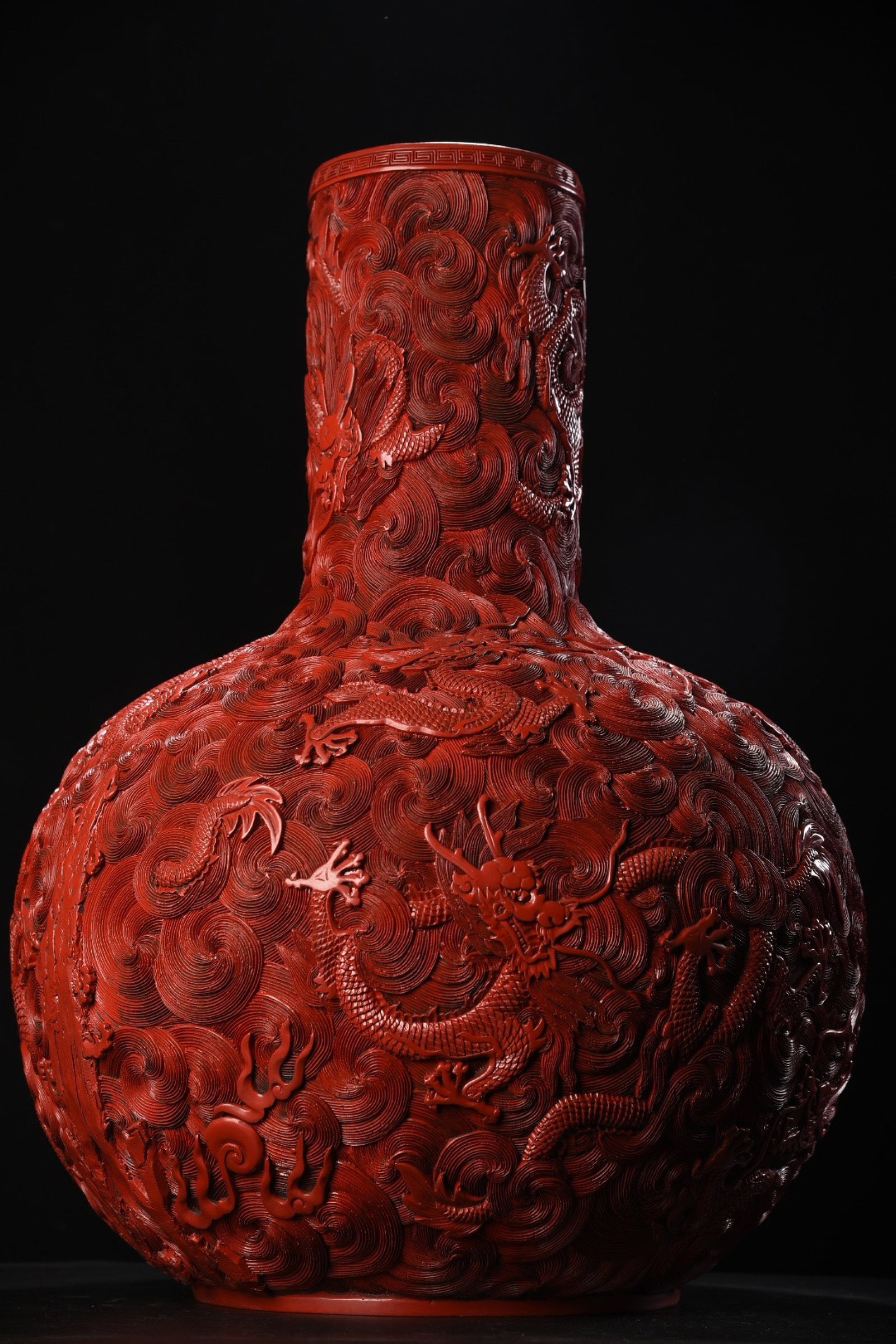 An Exquisite Carved Red Lacquer Dragon Pattern Vase: An Exquisite Carved Red Lacquer Dragon Pattern Vase,Qing Dynasty,China,Qianlong Six-character Mark,Size:23.6inx17.7in,Weight:6550g 剔红漆龙纹瓶,中国