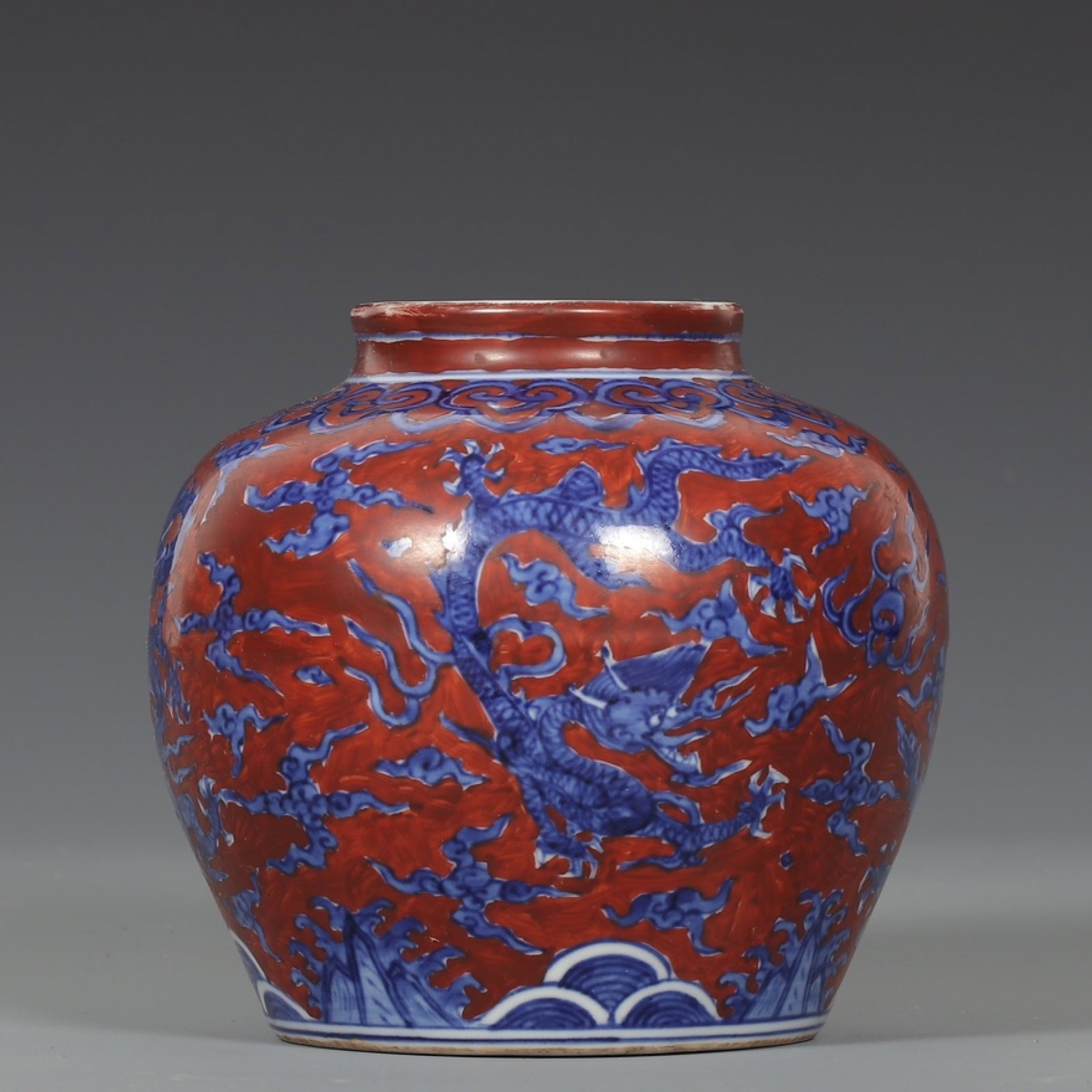 An Exquisite Red Ground Blue and White Auspicious Cloud and Dragon Pattern Jar: An Exquisite Red Ground Blue and White Auspicious Cloud and Dragon Pattern Jar,Ming Dynasty,China ,Wanli Six-character Mark,Size:5.1inx5.5in