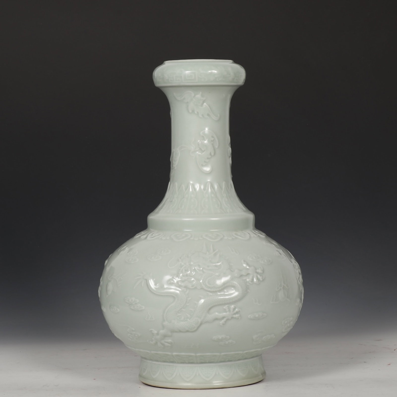 A Rare Celadon Glazed Auspicious Cloud and Dragon Pattern Vase: A Rare Celadon Glazed Auspicious Cloud and Dragon Pattern Vase,Qing Dynasty,China,Qianlong Six-character Mark,Size:14.6inx9.1in