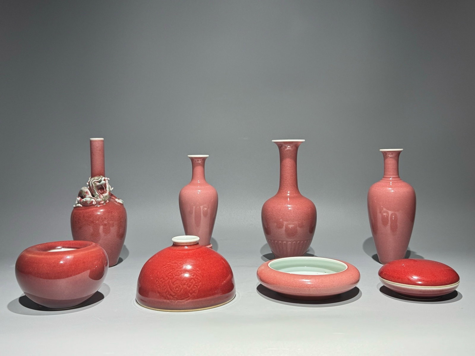 A Set of Fine PeachBloom-Glazed Ornaments: A Set of Fine PeachBloom-Glazed Ornaments,Qing Dynasty,China,Size:(Box)1.8inx3.9in,(Jar)3.4inx5.1in,(Brush Washer)2.7inx4.1in,1.4inx5.2in,(Vase)7inx2.4in,8inx3.5in,8.2inx3.3in,7.2inx2.8in 一