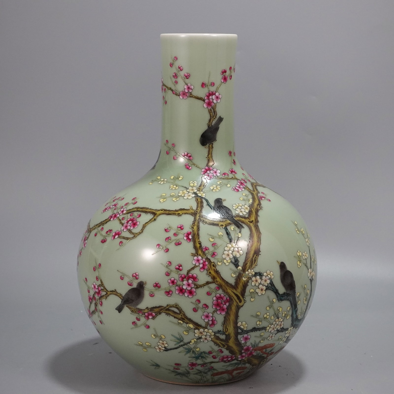 A Rare Famille-Rose Celadon Glazed Flower and Bird Pattern Vase: A Rare Famille-Rose Celadon Glazed Flower and Bird Pattern Vase,Qing Dynasty,China,Qianlong Six-character Mark,Size:13inx8.5in 粉彩青釉花鸟纹瓶,中