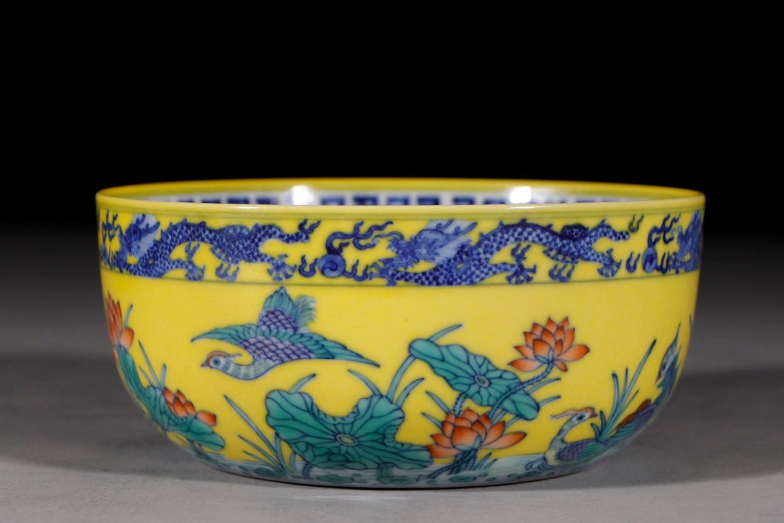 An Exquisite Yellow Ground Blue and White Doucai Flower and Mandarin Duck Pattern Bowl: An Exquisite Yellow Ground Blue and White Doucai Flower and Mandarin Duck Pattern Bowl,Qing Dynasty,China,Qianlong Six-character Mark,Size:3inx6.6in 黄地青花斗彩