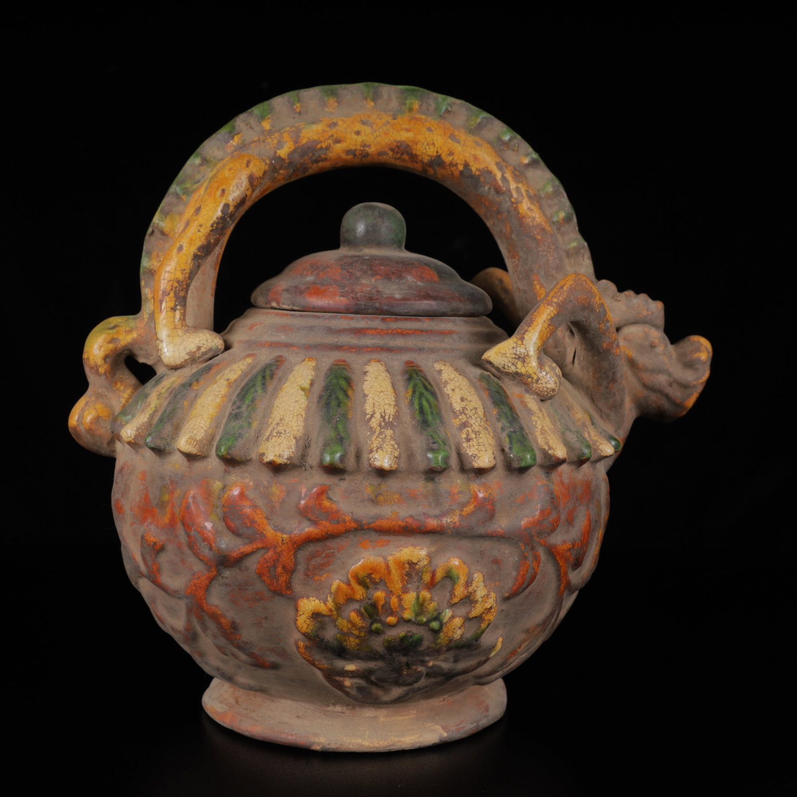An Exquisite Tang Tri-Color Glazed Pottery Dragon Pattern Ewer: An Exquisite Tang Tri-Color Glazed Pottery Dragon Pattern Ewer,Tang Dynasty,China,Size:8.7inx8.7inx7.1in,Weight:1200g