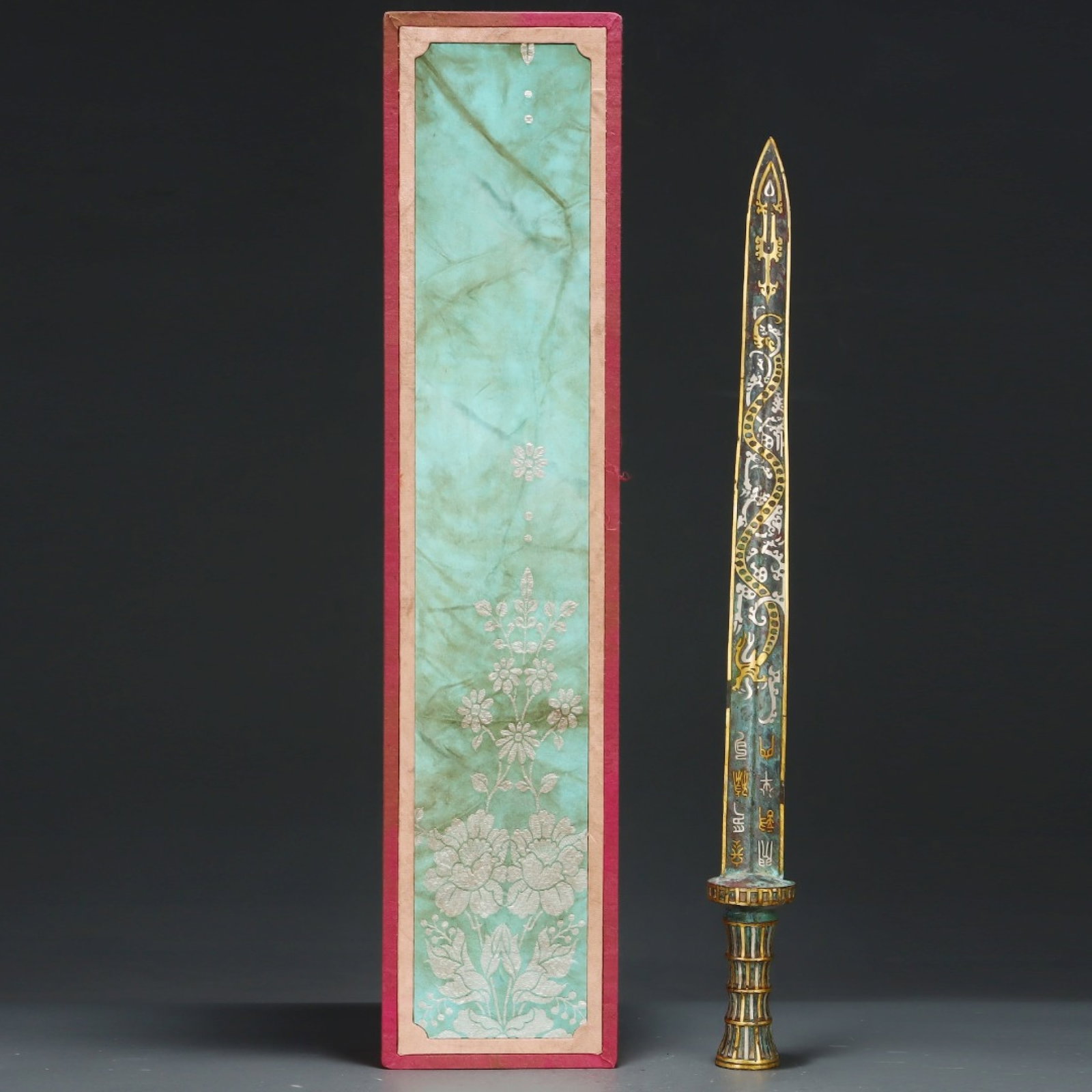 An Archaic Bronze Inlaid Gold and Silver Dragon Pattern Sword,With Inscription: An Archaic Bronze Inlaid Gold and Silver Dragon Pattern Sword,With Inscription,the Warring States period in China,Size:25.2inx2.4in 青铜错金银龙纹宝