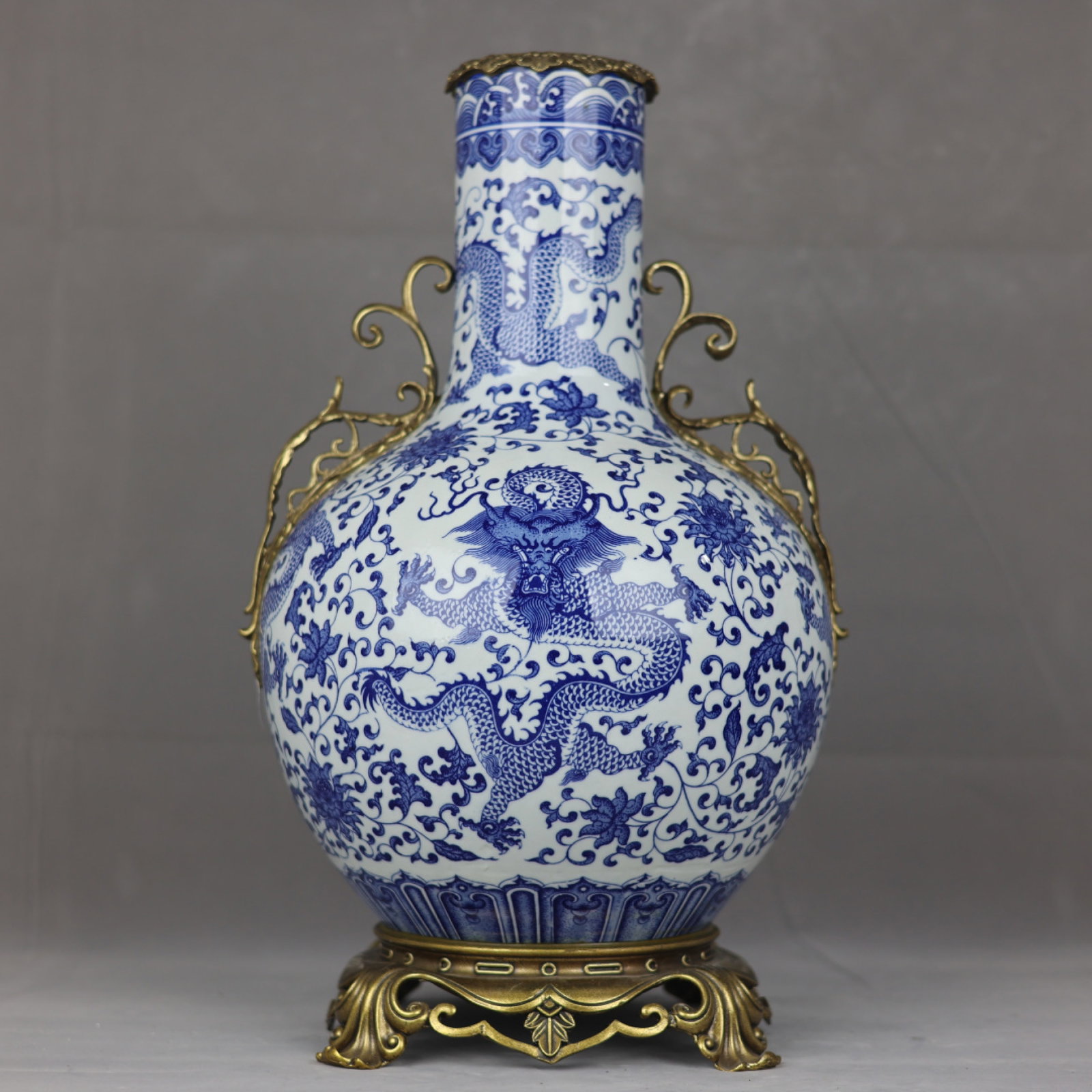 A Huge Blue and White Inlaid Bronze Lotus and Dragon Pattern Double-Ears Vase: A Huge Blue and White Inlaid Bronze Lotus and Dragon Pattern Double-Ears Vase,Qing Dynasty,China,Qianlong Six-character Mark,Size:20.9inx12.6in 青花镶铜缠枝莲