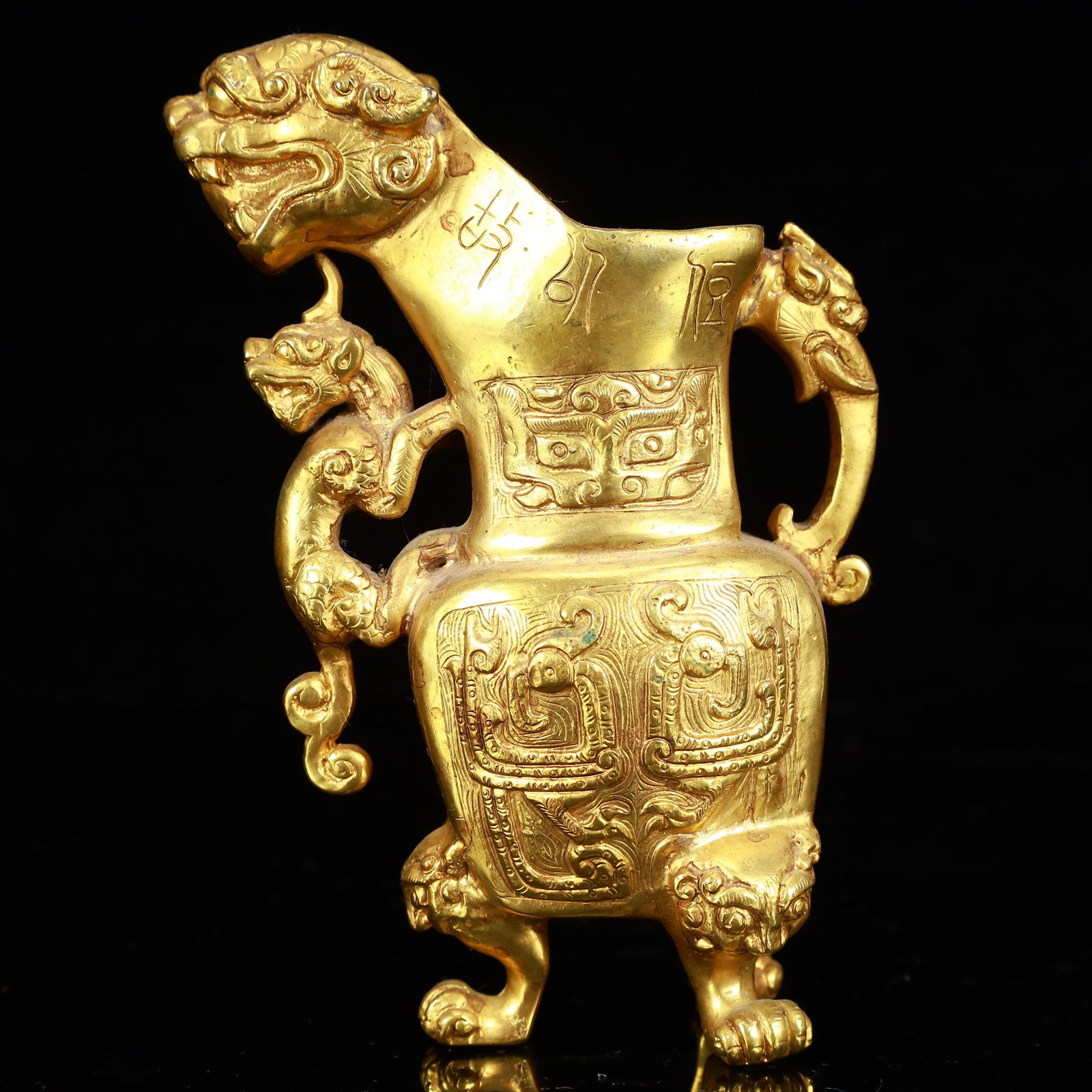 A Rare Gilt Bronze Lion Tripod Cup: A Rare Gilt Bronze Lion Tripod Cup,The Warring States period in China,Size:3.1inx2inx5.3in,Weight:1050g 铜鎏金狮子三足杯,中国战国