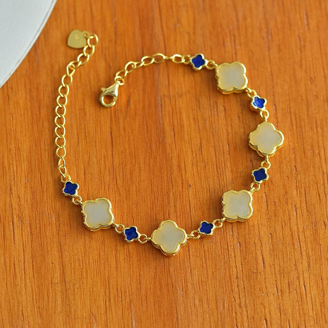 An Exquisite Sterling Silver-Gold Plated Inlaid White Jade Bracelet: An Exquisite Sterling Silver-Gold Plated Inlaid White Jade Bracelet,Size:0.3inx0.3in 纯银镀金镶白玉手链