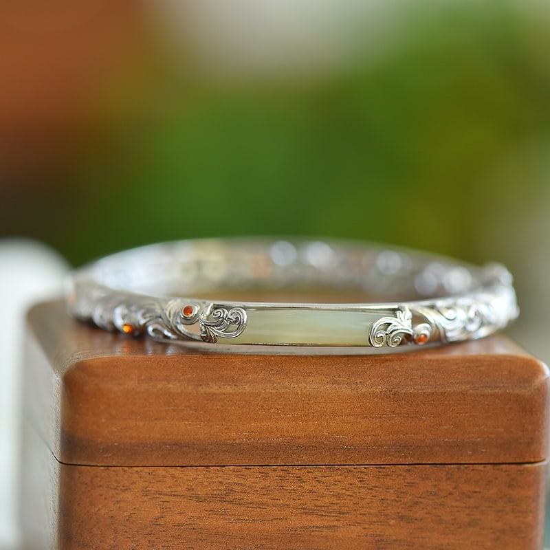 An Exquisite Sterling Silver Inlaid Greenish Jade Bracelet: An Exquisite Sterling Silver Inlaid Greenish Jade Bracelet 纯银镶青玉手镯