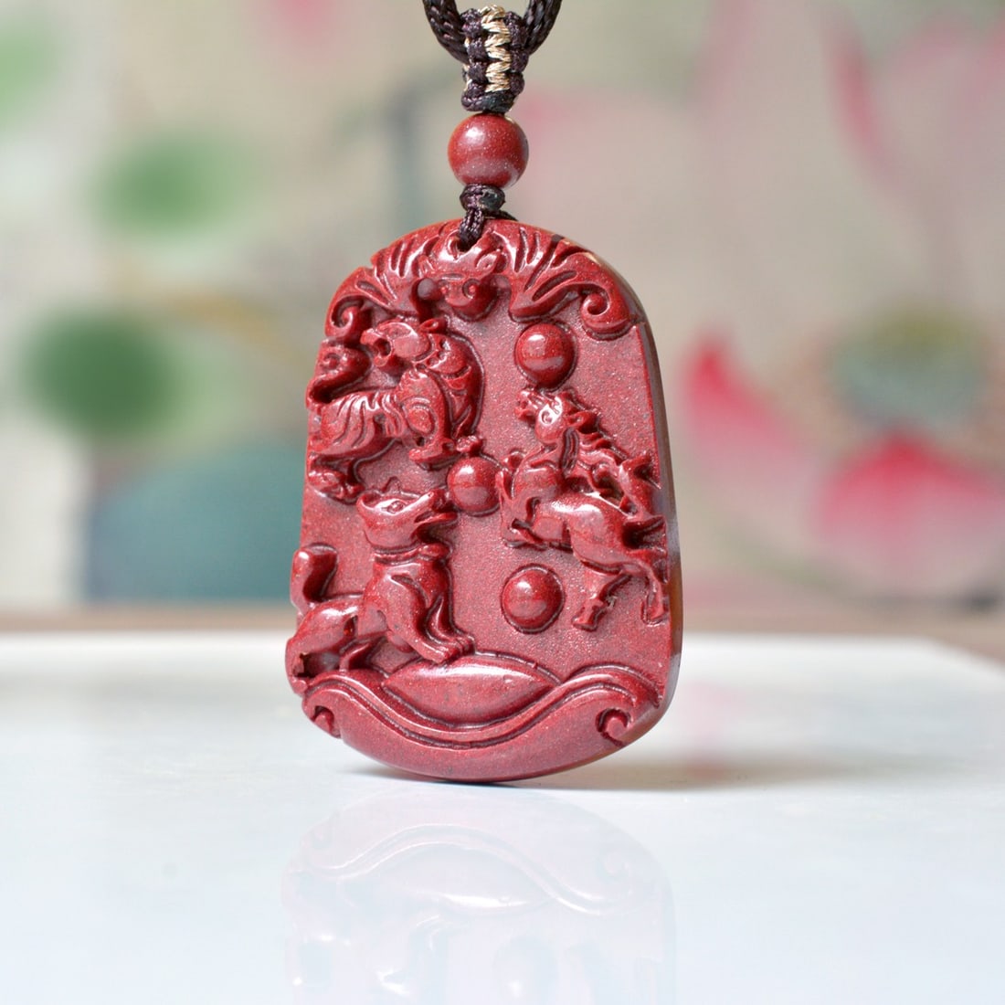 An Exquisite Cinnabar Animal Pattern Pendant: An Exquisite Cinnabar Animal Pattern Pendant,Size:1.2inx1.7in,Weight:32.06g 朱砂动物纹挂件