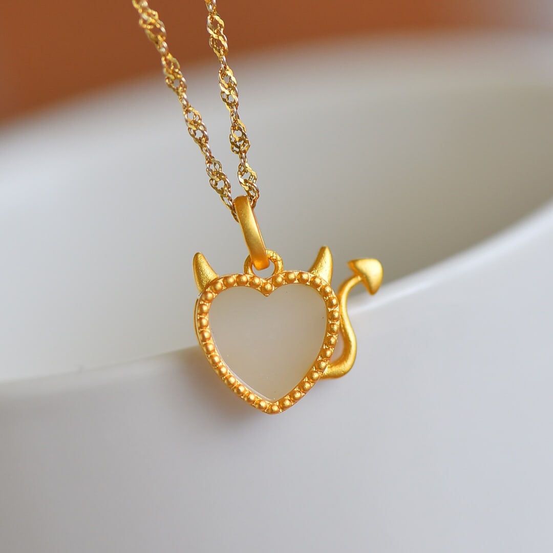 An Exquisite Sterling Silver-Gold Plated Inlaid White Jade Pendant: An Exquisite Sterling Silver-Gold Plated Inlaid White Jade Pendant , Size :0.4inx0.4in 纯银镀金镶白玉吊坠,尺寸:0.4inx0.4in