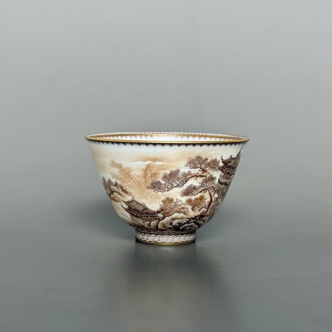 An Exquisite Ink Color Painted Gold Landscape Pattern Cup: An Exquisite Ink Color Painted Gold Landscape Pattern Cup Qing Dynasty, China Yongzheng Four-character Mark Size:1.7inx2.6in墨彩描金图案边蓬莱