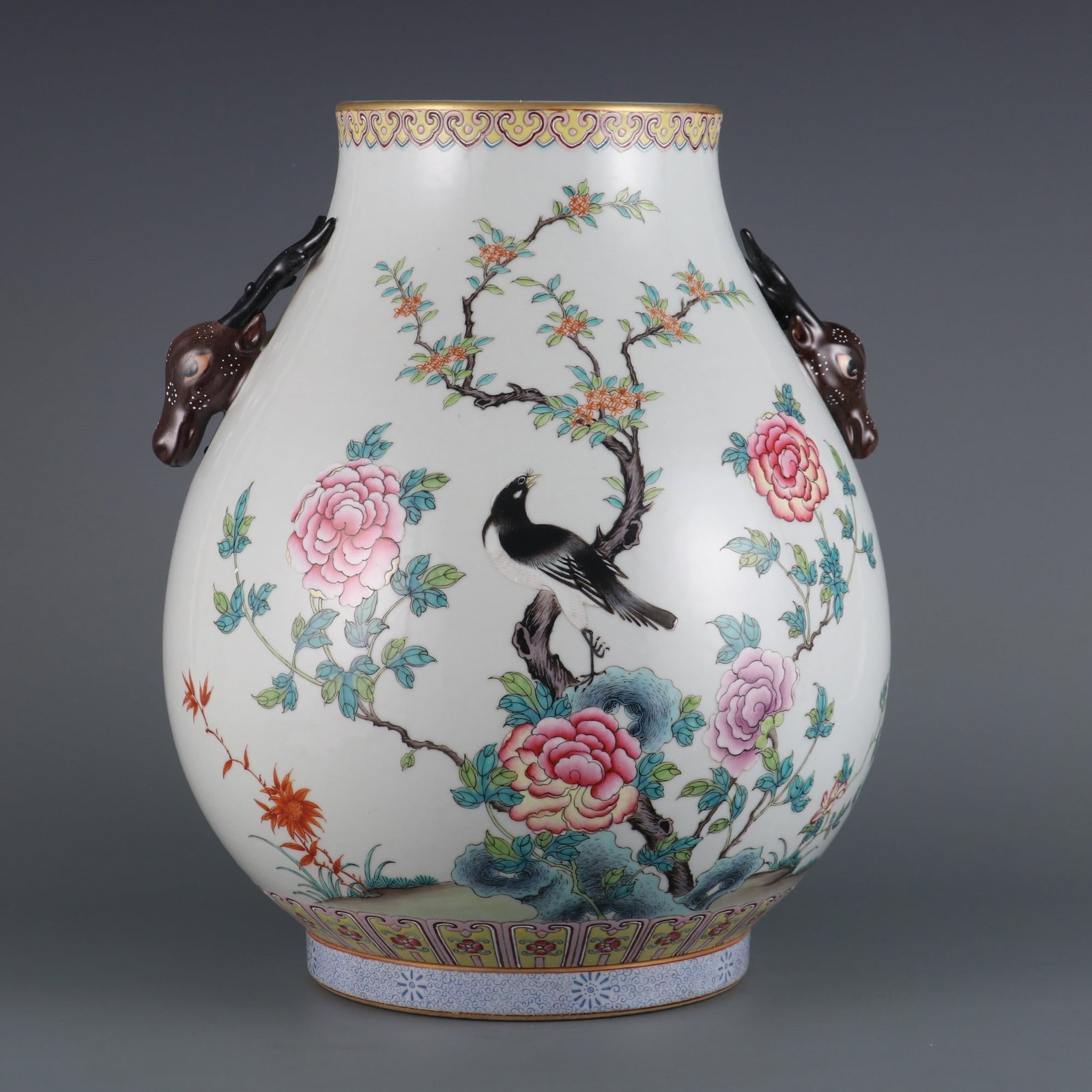 An Exquisite Famille-Rose Flower and Bird Pattern Double-Ears Vase: An Exquisite Famille-Rose Flower and Bird Pattern Double-Ears Vase Qing Dynasty, China Qianlong Six-character Mark Size:13.2inx5.7in粉彩花鸟纹鹿头尊 