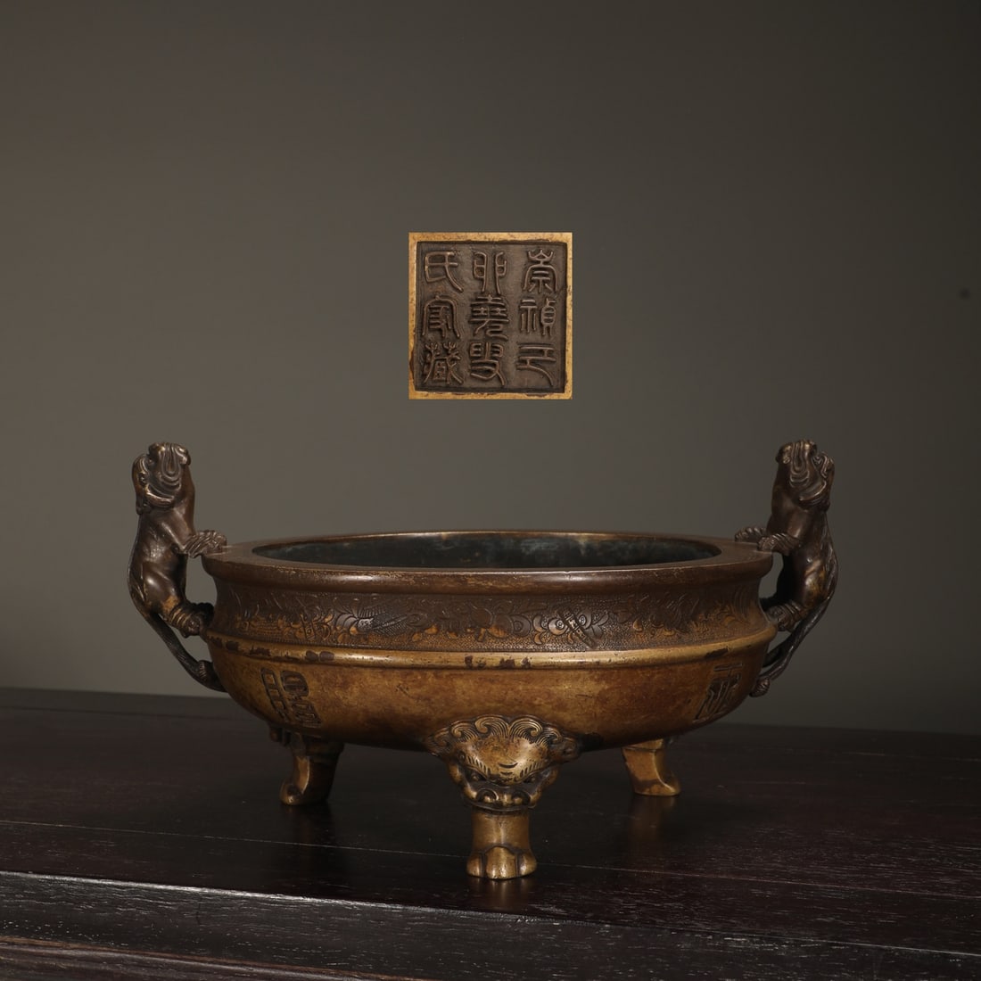 An Exquisite Bronze Double-Ears and Tripod Censer: An Exquisite Bronze Double-Ears and Tripod Censer Ming Dynasty, China Size:5.1inx7.6in Weight:2850g铜狻猊耳兽足炉 中国明代 Size:13cmx1
