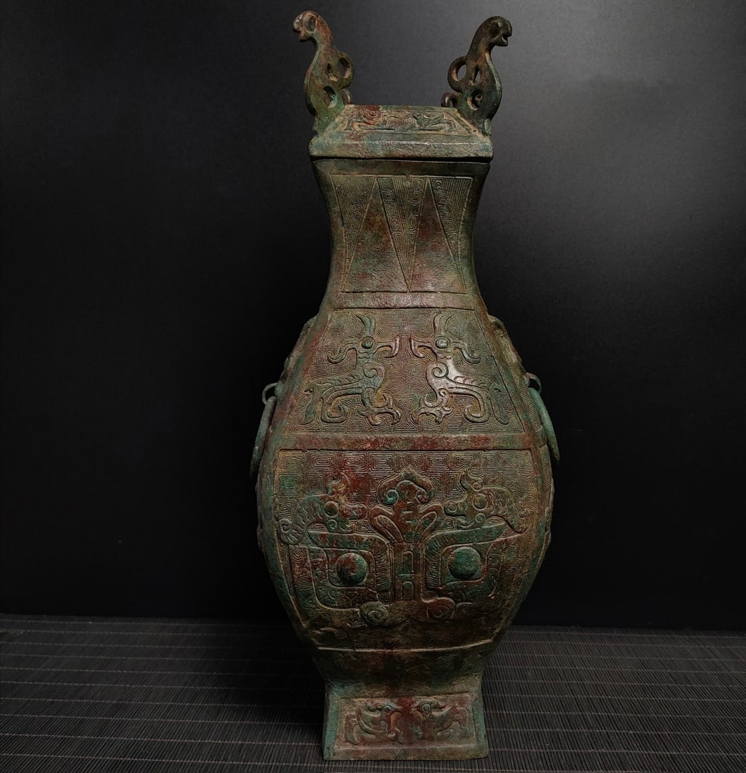 An Exquisite Bronze Beast-Face Pattern Double-Ears Vase: An Exquisite Bronze Beast-Face Pattern Double-Ears Vase N.Zhou , China Size:14.2inx6.7in Weight:2.6kg青铜兽面方瓶 北周时期 Size:36cmx17cm We