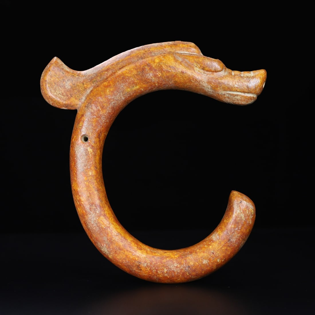 An Exquisite Hemo Jade Dragon Ornament: An Exquisite Hemo Jade Dragon Ornament Han Dynasty, China Size:9inx8.5inx1.2in Weight:954.5g河磨玉C形龙 中国汉代 Size:22.8cmx21.5cmx3cm Weight:954