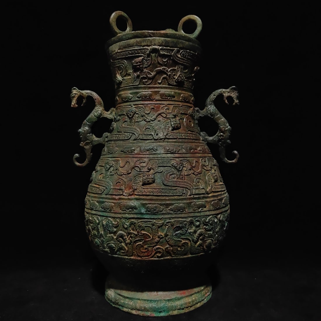 An Exquisite Bronze Dragon Pattern Double-Ears Vase: An Exquisite Bronze Dragon Pattern Double-Ears Vase N.Zhou , China Size:13inx7.9in Weight:2.8kg青铜双龙瓶 北周时期 Size:33cmx20cm Weight:2.8kg