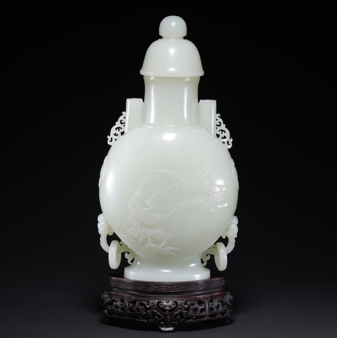 An Exquisite White Jade Crane Pattern Ganoderma lucidum Pattern Vase: An Exquisite White Jade Crane Pattern Ganoderma lucidum Pattern Vase Qing Dynasty, China Size:8.1inx4.3inx2.8in Weight:798.6g白玉仙鹤灵芝纹瓶 中&#