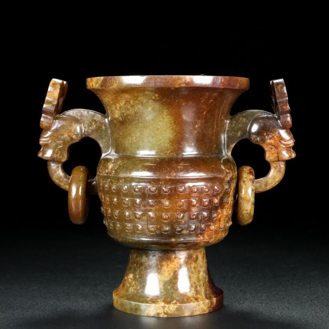 An Exquisite White Jade Double-Ears Goblet: An Exquisite White Jade Double-Ears Goblet Qing Dynasty, China Size:4.7inx5.7inx3.5in Weight:583g白玉双环龙爵杯 中国清代 Size:12cmx14.