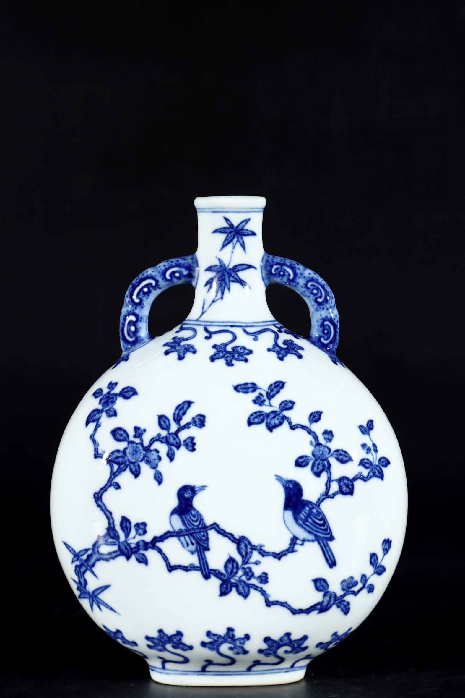 An Exquisite Blue and White Flower and Bird Pattern Double-Ears Vase: An Exquisite Blue and White Flower and Bird Pattern Double-Ears Vase Qing Dynasty, China Qianlong Six-character Mark Size:10.4inx7.7in青花花鸟双耳抱月&#