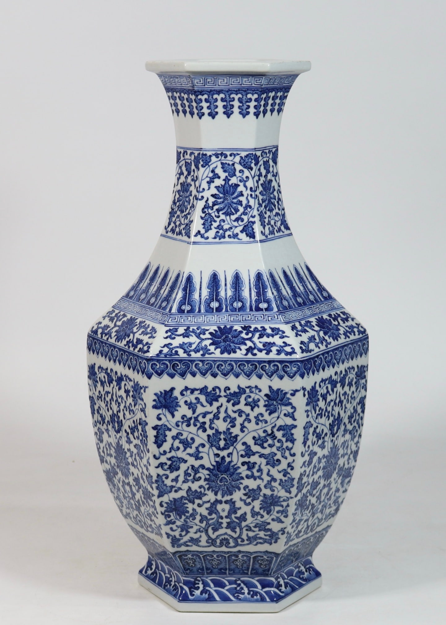 An Exquisite Blue and White Lotus Pattern Seawater Pattern Vase: An Exquisite Blue and White Lotus Pattern Seawater Pattern Vase Qing Dynasty, China Qianlong Six-character Mark Size:18.7inx9.3in青花缠枝花卉六方瓶