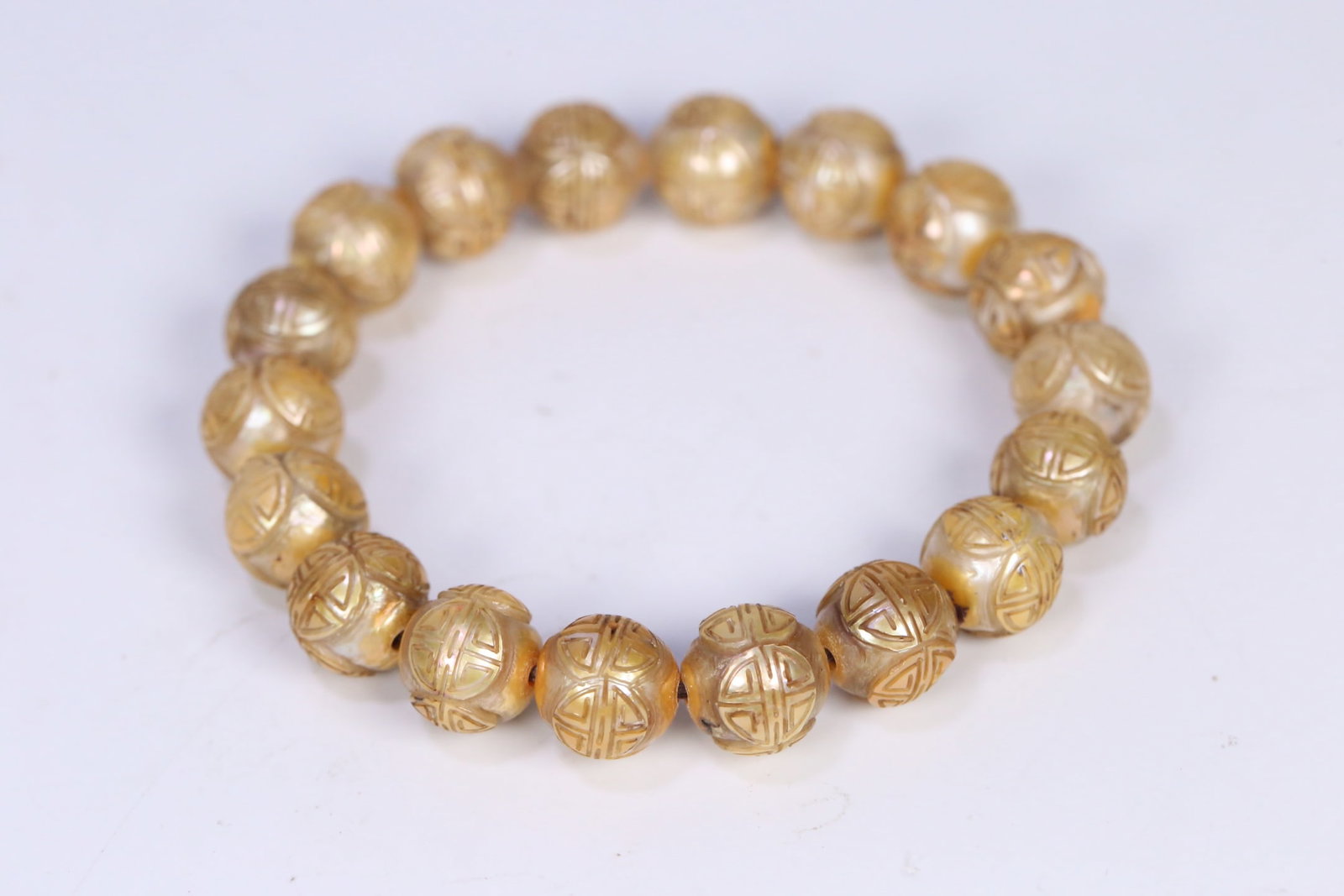 An Exquisite Pearl Bracelets: An Exquisite Pearl Bracelets Qing Dynasty, China Size:0.5in Weight:37.6g珍珠团寿纹手串 中国清代 Size:1.2cm Weight:37.6g