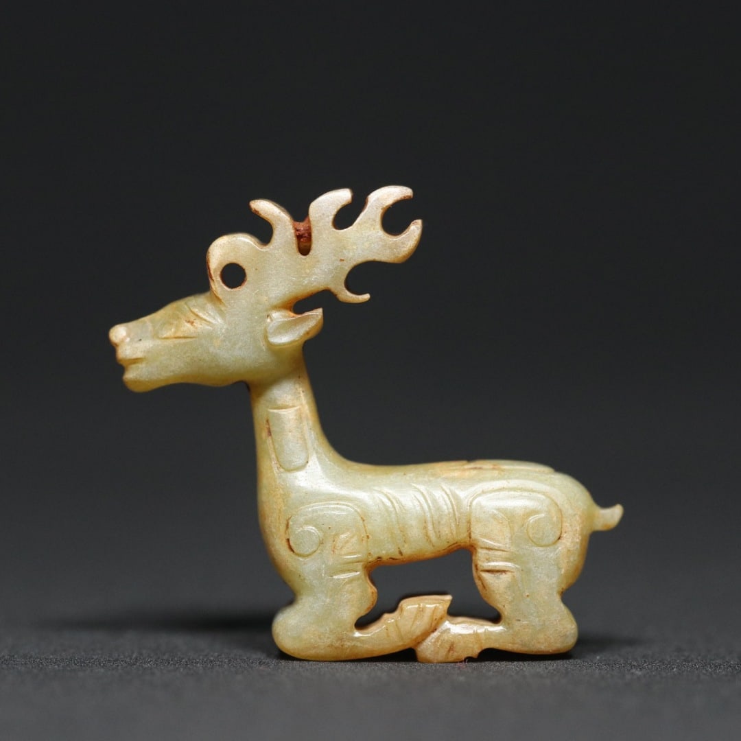 An Exquisite White Jade Deer Ornament: An Exquisite White Jade Deer Ornament W.Zhou , China Size:1.6inx0.5inx1.5in Weight:14.5g白玉鹿摆件 西周时期 Size:4.1cmx1.2cmx3.7cm Weight:14.5g