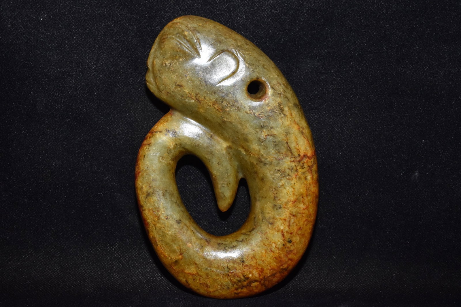 An Exquisite Hemo Jade Ornament: An Exquisite Hemo Jade Ornament Hong Shan Culture Size:6.7inx4.3in Weight:690g河磨玉龙人 红山文化 Size:17cmx11cm Weight:690g