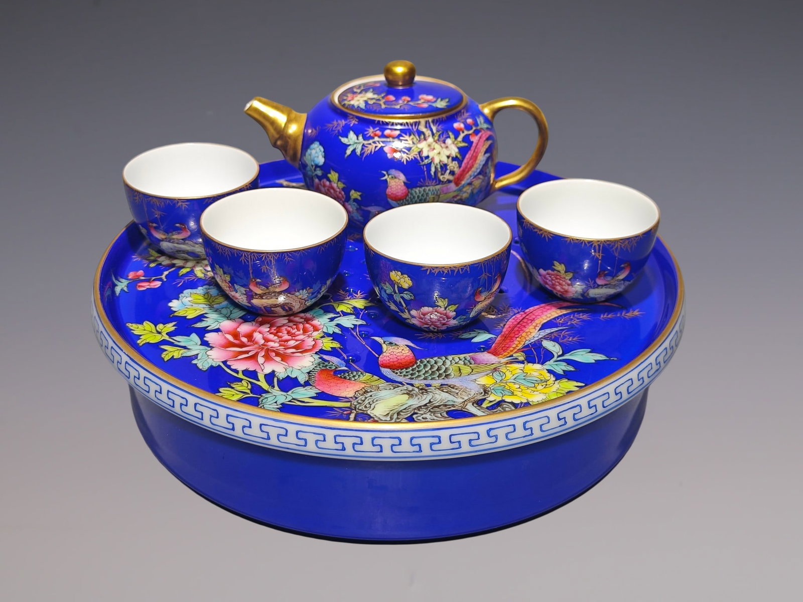 A Set of Fine Enamel Painted Gold Flower and Bird Pattern with poem Teapot Cup: A Set of Fine Enamel Painted Gold Flower and Bird Pattern with poem Teapot Cup Qing Dynasty, China Qianlong Four-character Mark Size:3.3inx5.6in Size:1.5inx2.4in Size:2.7inx9in珐琅彩