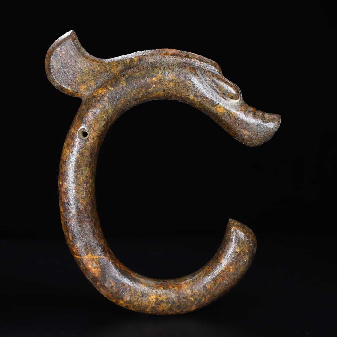 An Exquisite Hemo Jade Dragon: An Exquisite Hemo Jade Dragon Han Dynasty, China Size:9.3inx7.8inx1.2in Weight:949.5g河磨玉C形龙 中国汉代 Size:23.5cmx19.7cmx3cm Weight:949.5g