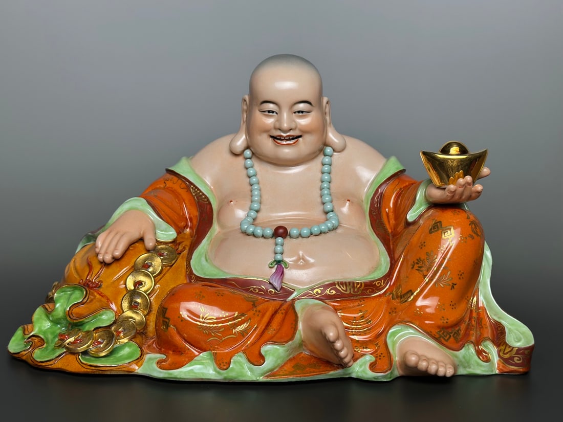 An Exquisite Iron-Red Painted Gold Statue of Arhat: An Exquisite Iron-Red Painted Gold Statue of Arhat the Republic of China Size:7.8inx12.4in矾红描金布袋罗汉 民国 Size:19.8cmx31.5cm
