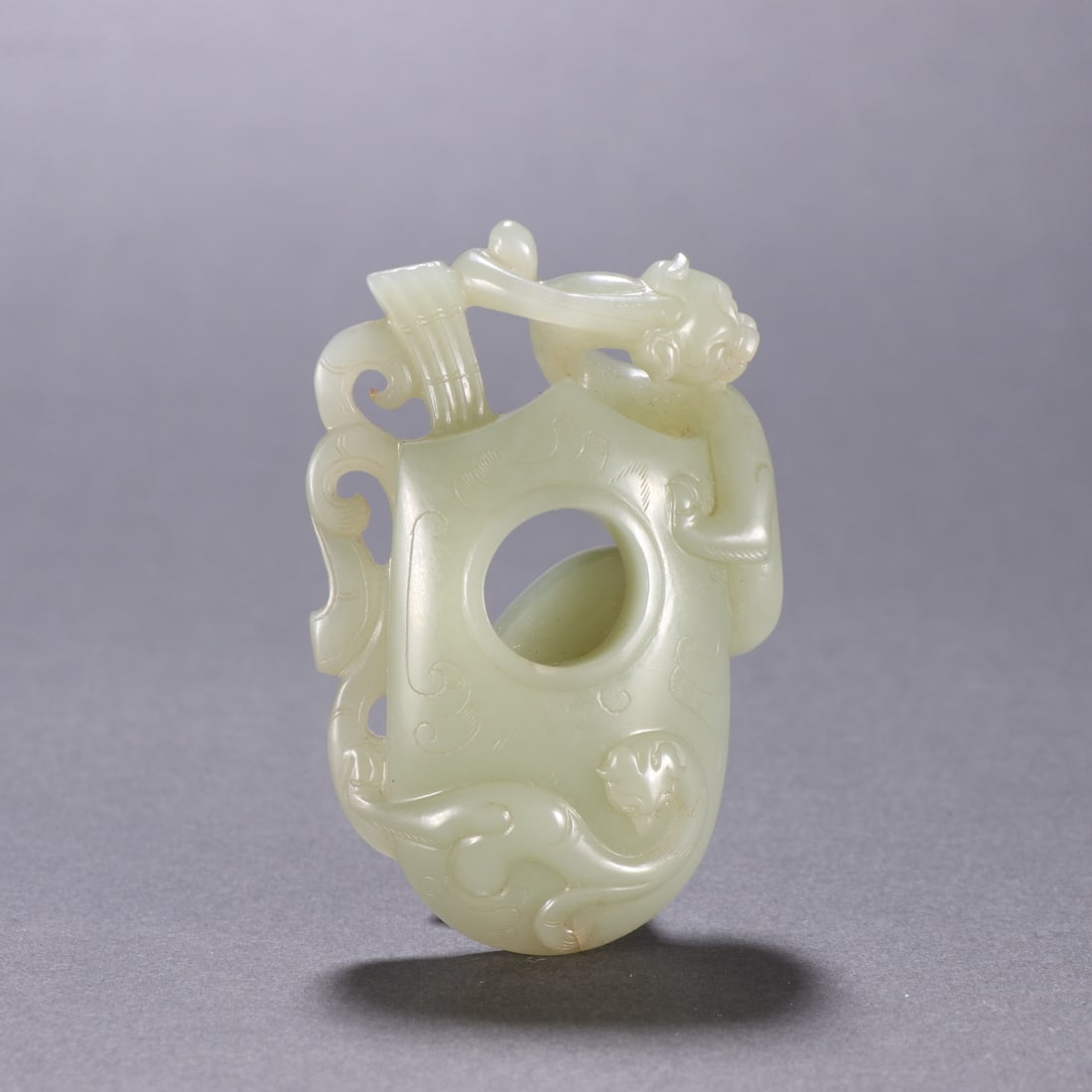 An Exquisite White Jade Chi-Dragon Pattern Pendant: An Exquisite White Jade Chi-Dragon Pattern Pendant Qing Dynasty, China Size:2.8inx1.8in Weight:60.6g白玉螭龙鸡心佩 中国清代 Size:7cmx4