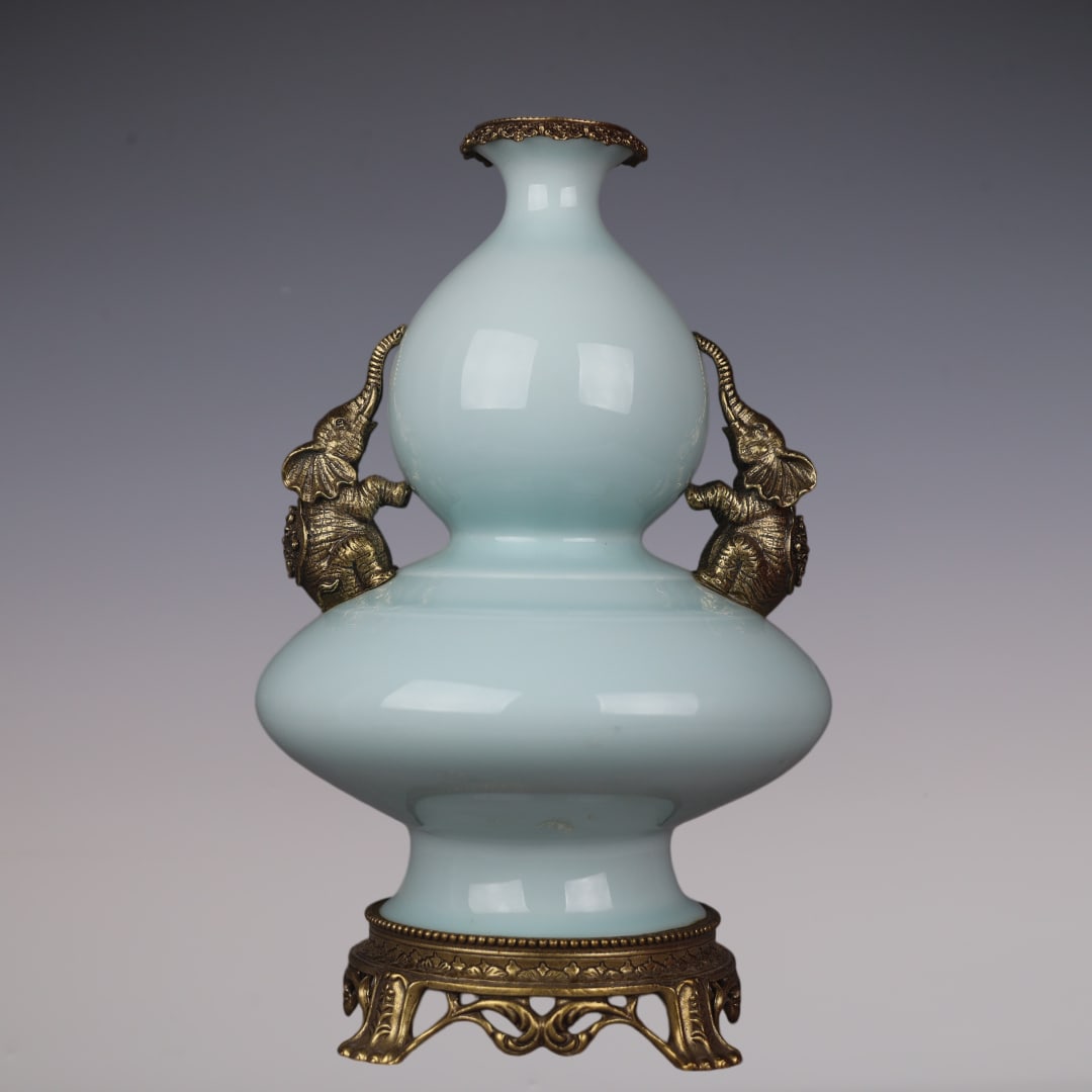 An Exquisite Shadow Blue Glaze Inlaid Bronze Gourd-Shaped Double-Ears Vase: An Exquisite Shadow Blue Glaze Inlaid Bronze Gourd-Shaped Double-Ears Vase Qing Dynasty, China Qianlong Six-character Mark Size:15.4inx8.7in影青釉镶铜象耳!