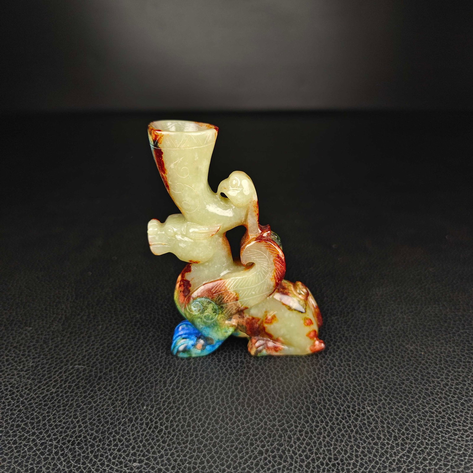 An Exquisite White Jade Auspicious Beast-Shaped Cup: An Exquisite White Jade Auspicious Beast-Shaped Cup Han Dynasty, China Size:3.3inx2.4in Weight:106g白玉龙鳳杯 中国汉代 Size:8.5cmx6cm Weight:106g