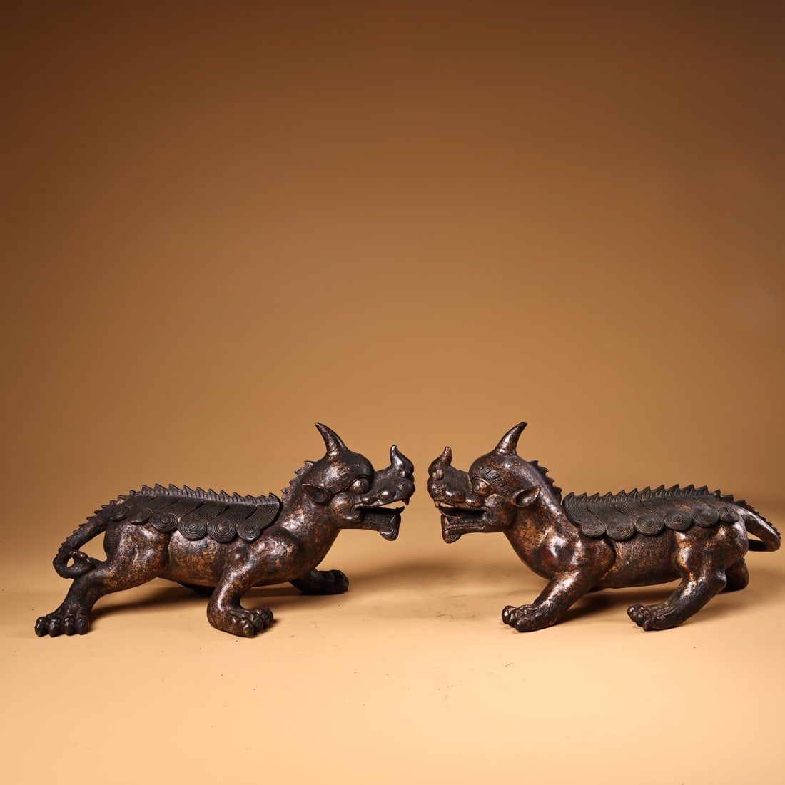 A Pair of Exquisite Gilt Bronze Auspicious Beast Ornament: A Pair of Exquisite Gilt Bronze Auspicious Beast Ornament Han Dynasty, China Size:5.5inx7.1in Weight:1480g铜鎏金独角兽一对
