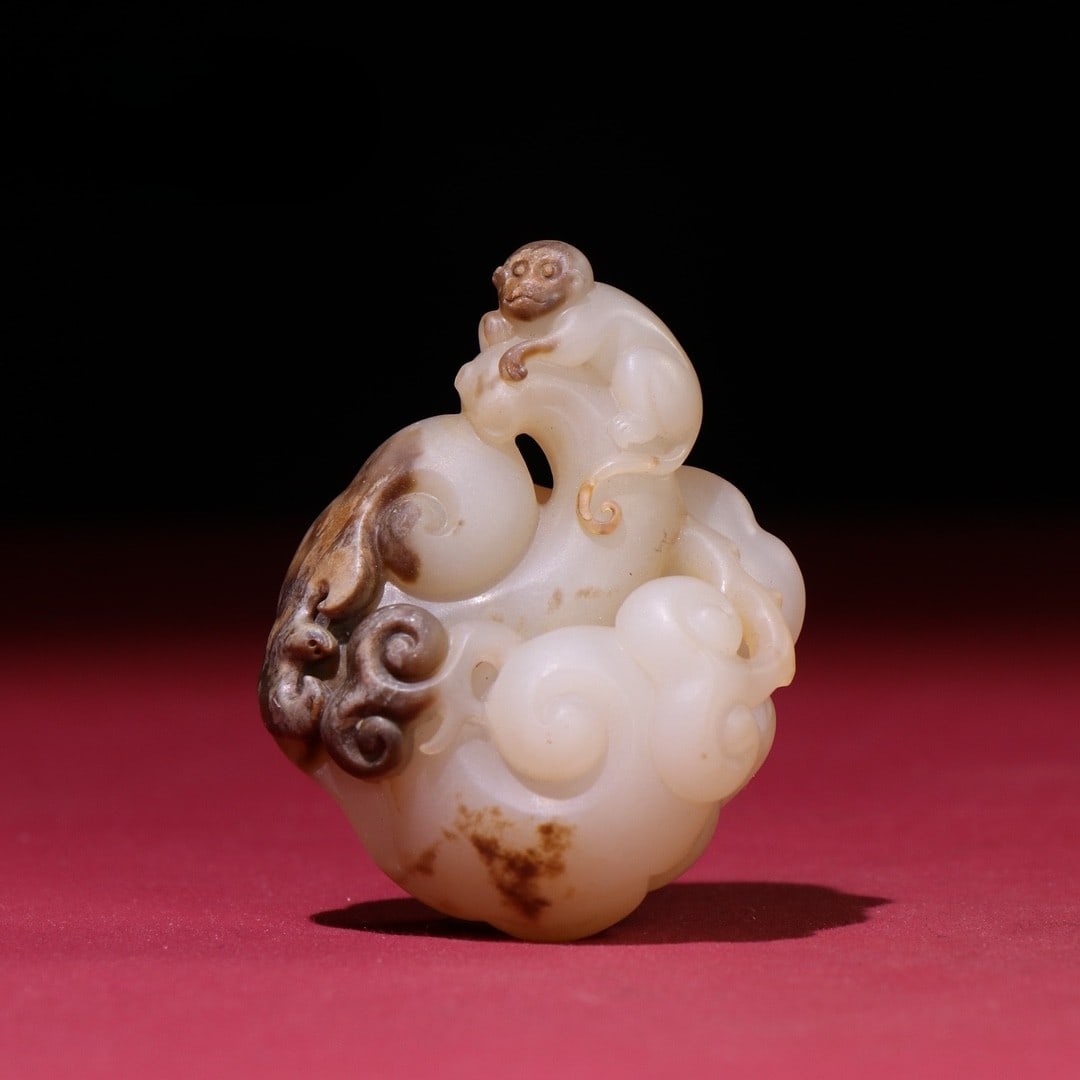 An Exquisite White Jade Monkey Pattern Pendant: An Exquisite White Jade Monkey Pattern Pendant Han Dynasty, China Size:2.4inx1.7inx0.8in Weight:55g白玉如意吊坠 中国汉代 Size:6cmx4.4cmx2.1c