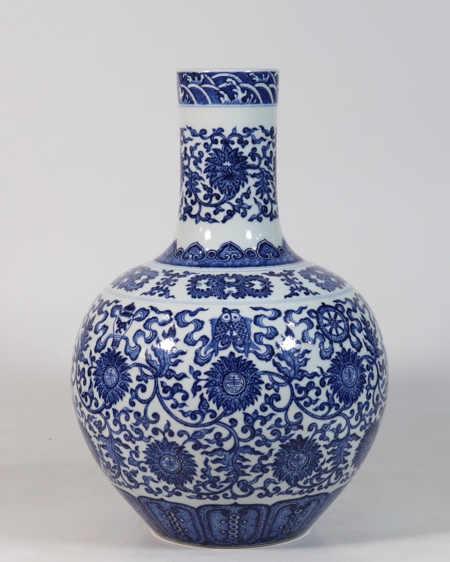 An Exquisite Blue and White Lotus Pattern Eight Treasures Pattern Vase: An Exquisite Blue and White Lotus Pattern Eight Treasures Pattern Vase Qing Dynasty, China Qianlong Six-character Mark