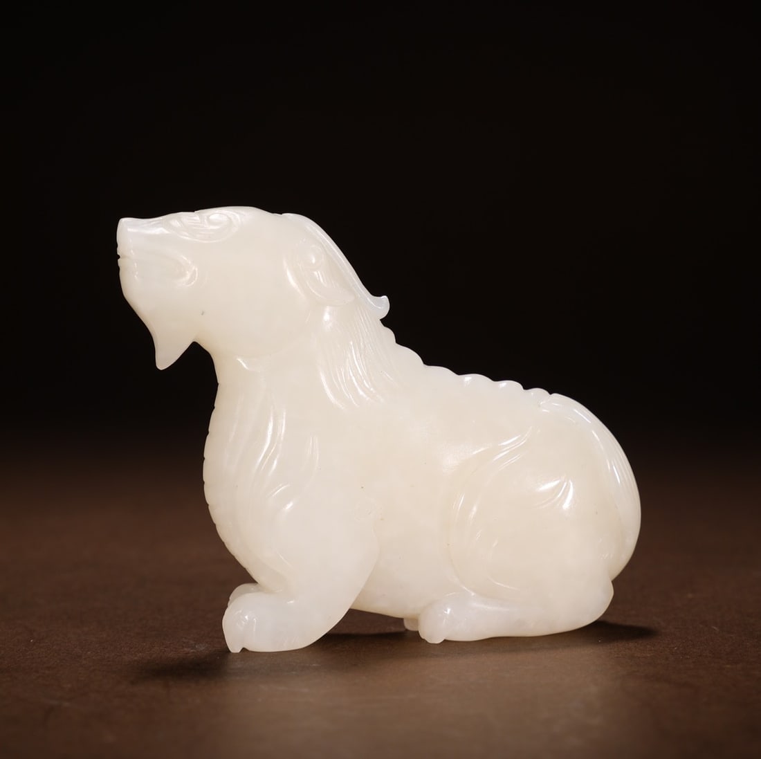 An Exquisite White Jade Auspicious Beast Hand Piece: An Exquisite White Jade Auspicious Beast Hand Piece Qing Dynasty, China Size:2.8inx0.7inx2.4in Weight:100g白玉瑞兽把件 中国清代 Size:7cmx1.7