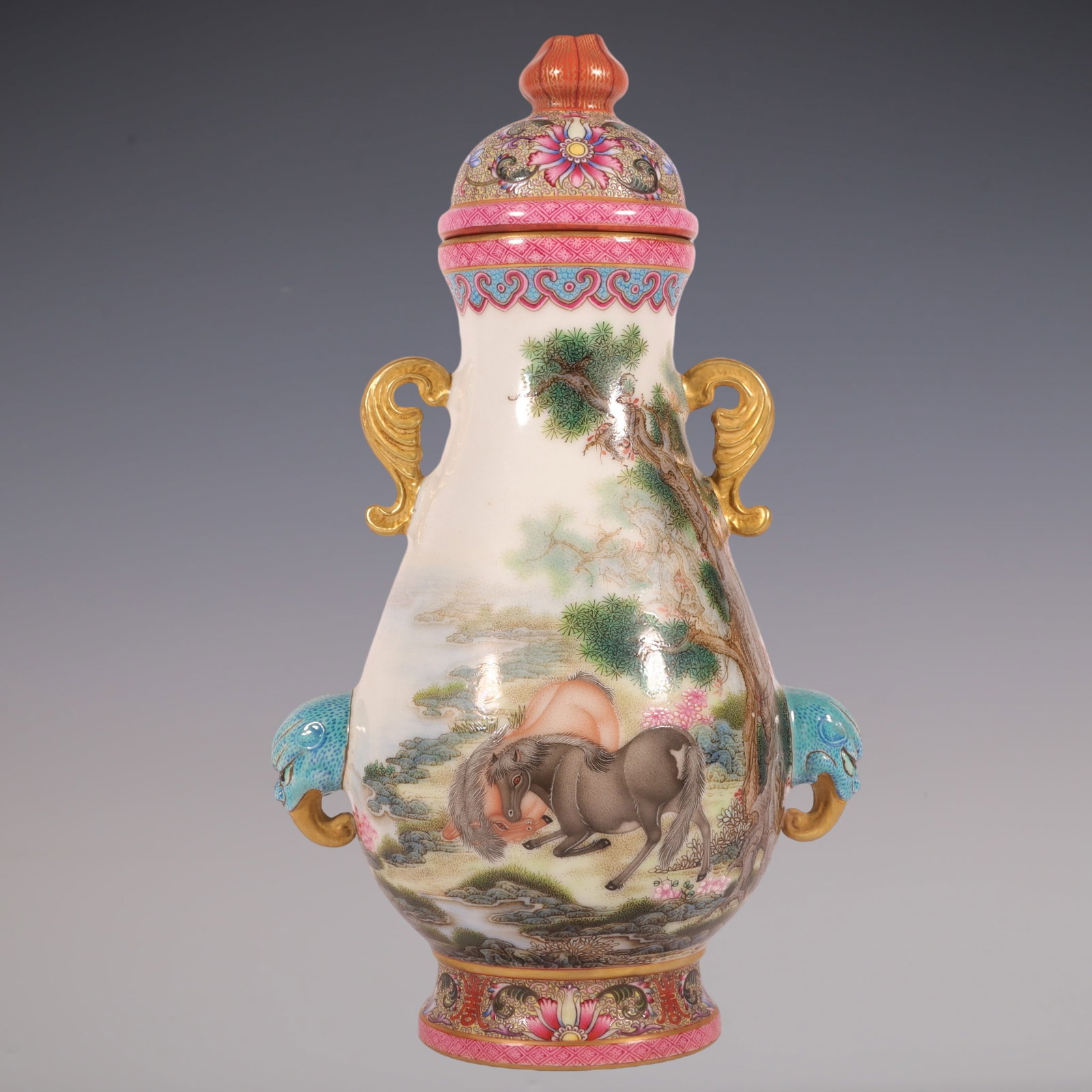 An Exquisite Enamel Animal Pattern Lotus Pattern Double-Ears Jar: An Exquisite Enamel Animal Pattern Lotus Pattern Double-Ears Jar Qing Dynasty, China Qianlong Four-character Mark Size:9.3inx5.1in珐琅彩通景画马双೑