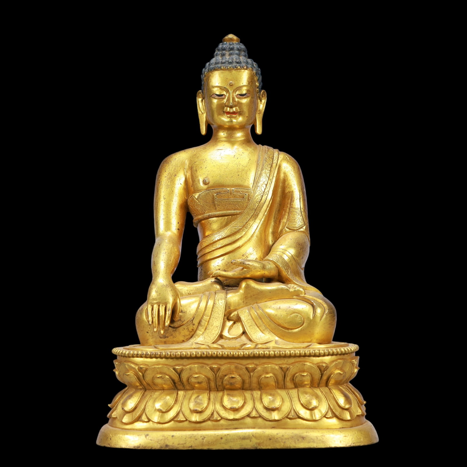 A Exquisite Gilt Bronze Statue of Sakyamuni: A Exquisite Gilt Bronze Statue of Sakyamuni Ming Dynasty, China Size:6.7inx4.7inx10.2in Weight:3400g铜鎏金如来 中国明代 Size:17cmx12cmx26cm