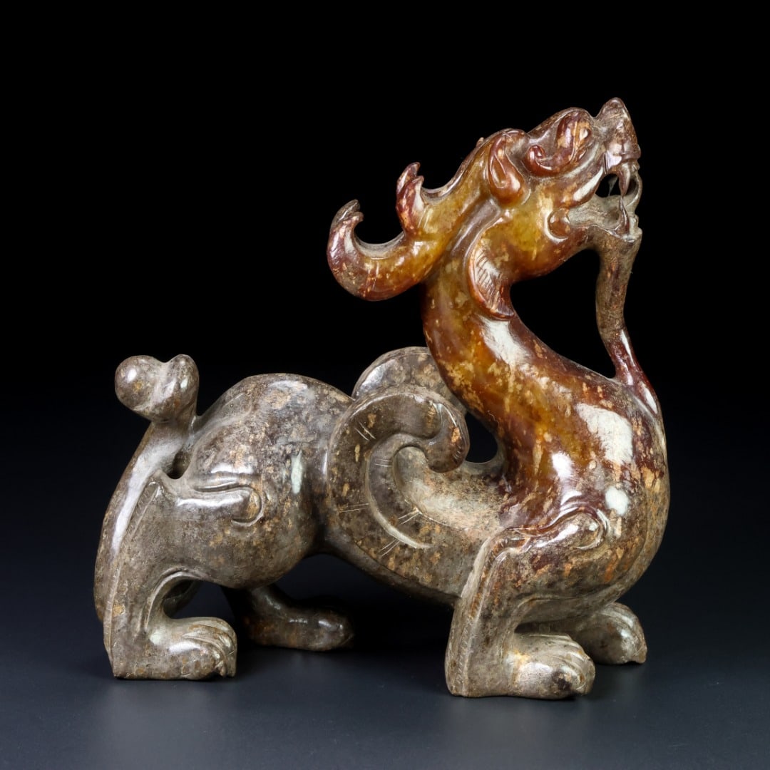 An Exquisite White Jade Dragon Ornament: An Exquisite White Jade Dragon Ornament Han Dynasty, China Size:6inx6.1inx2.5in Weight:1.13kg白玉龙 中国汉代 Size:15.2cmx15.4cmx6.4cm Weight:1.13kg