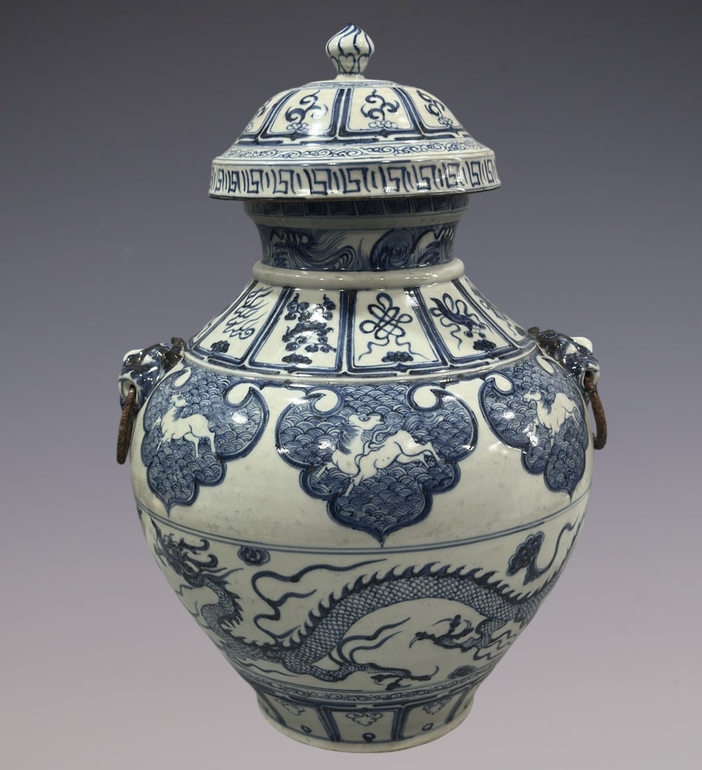 An Exquisite Blue and White Lotus Pattern Dragon Pattern Double-Ears Jar: An Exquisite Blue and White Lotus Pattern Dragon Pattern Double-Ears Jar Yuan Dynasty, China Size:18.7in青花缠枝莲龙纹大罐 中国元